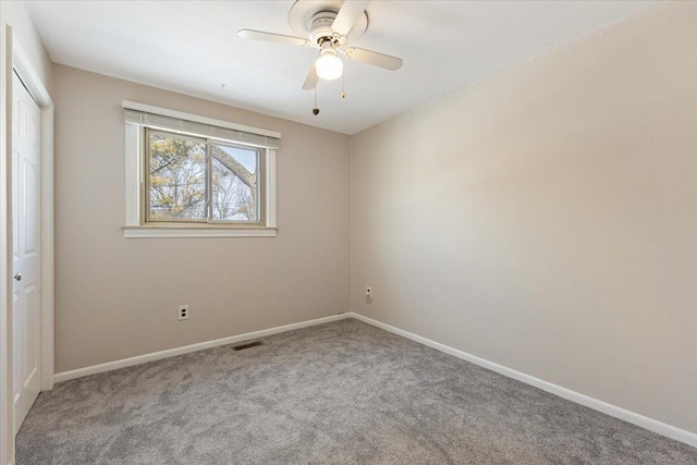 unfurnished bedroom with light carpet, baseboards, visible vents, and a closet