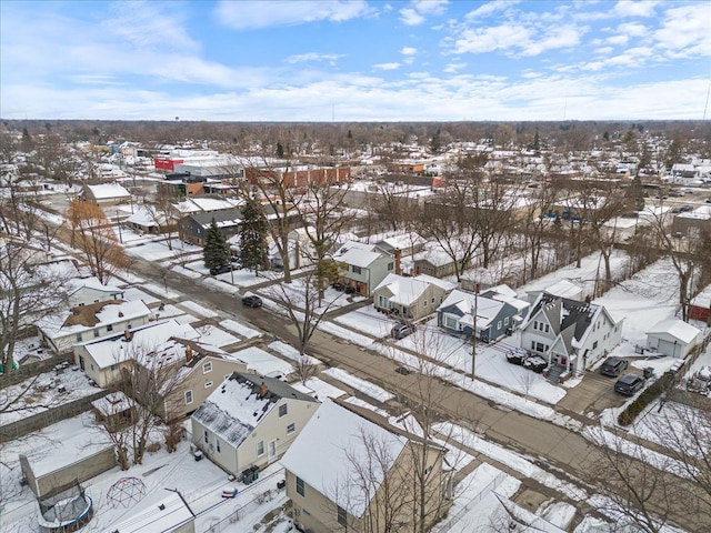 snowy aerial view featuring a residential view