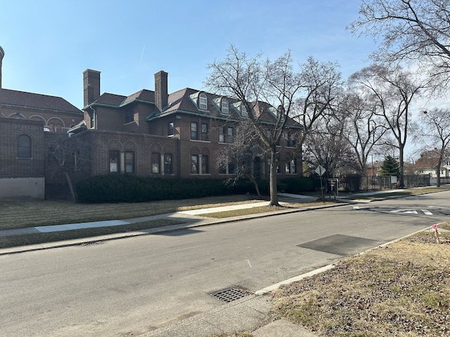 view of road with a residential view, curbs, and sidewalks