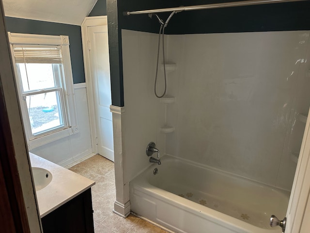 full bath featuring vanity, tile patterned floors, bathing tub / shower combination, and lofted ceiling