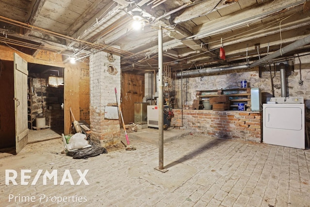 unfinished basement with washer / dryer