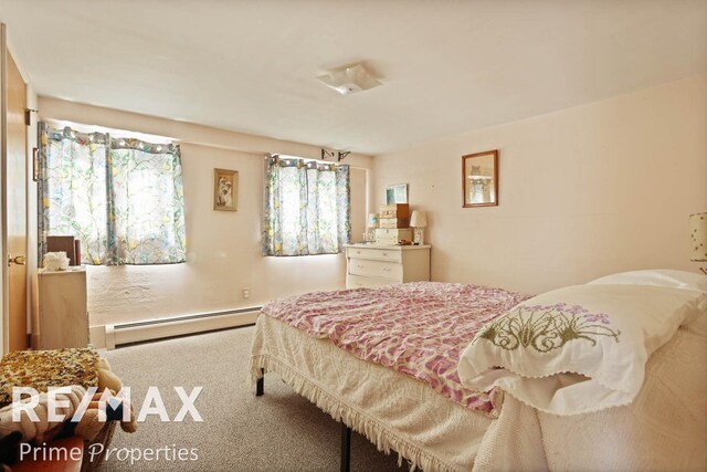 bedroom featuring a baseboard radiator and carpet flooring