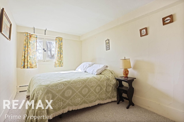 carpeted bedroom featuring a baseboard radiator