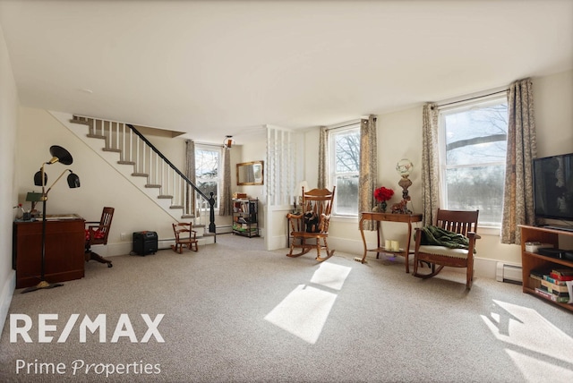 living area featuring a baseboard heating unit, carpet flooring, stairway, and baseboards