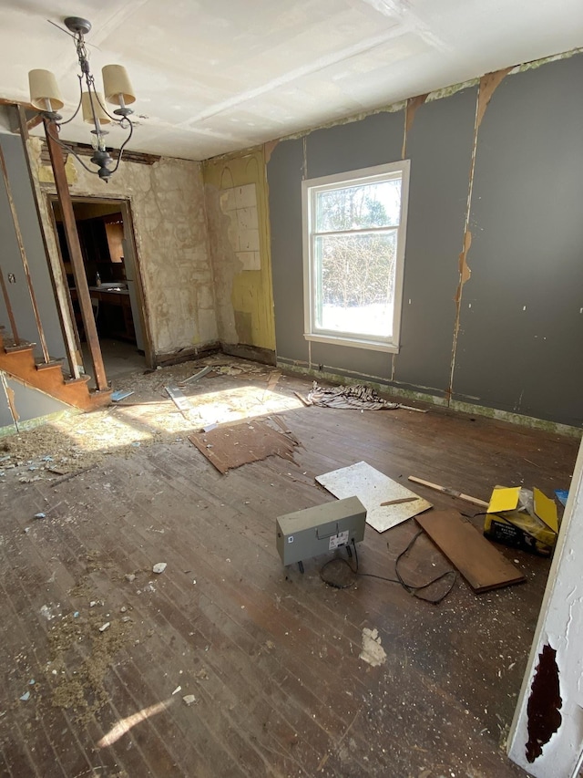 miscellaneous room with a notable chandelier