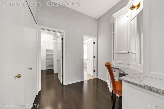 28036 Hickory Cir, Farmington Hills, MI 48331 - office area featuring built in study area, baseboards, and dark wood finished floors