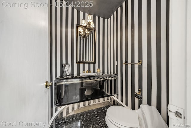 28036 Hickory Cir, Farmington Hills, MI 48331 - half bathroom with toilet, a chandelier, baseboards, wallpapered walls, and tile patterned flooring