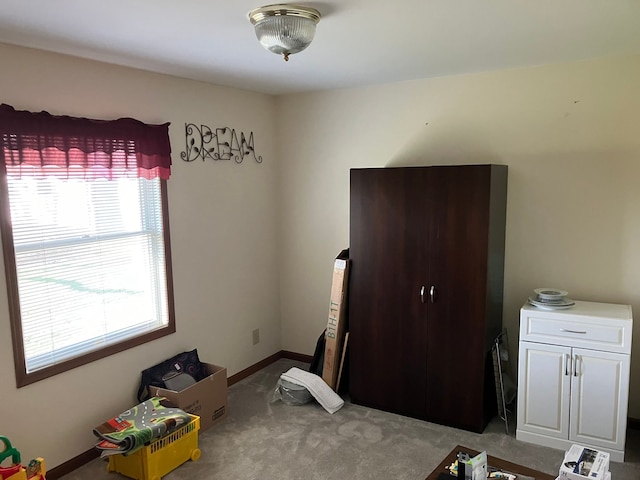 carpeted bedroom with baseboards