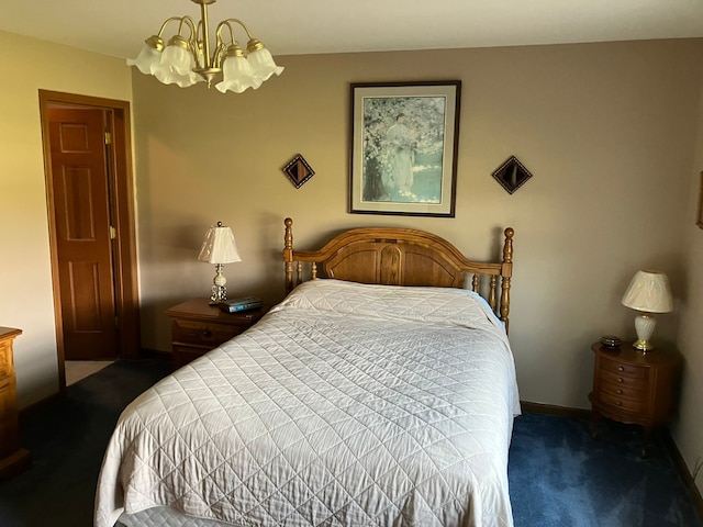 bedroom featuring a chandelier, dark colored carpet, and baseboards