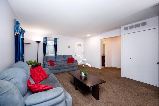 living room with carpet and visible vents