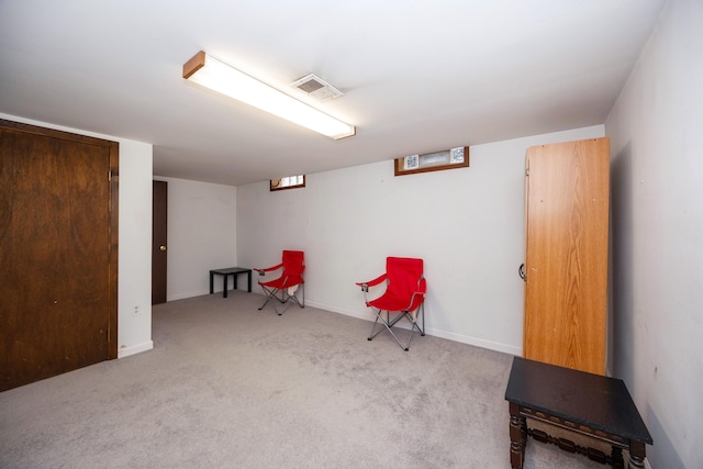 sitting room with light carpet, baseboards, and visible vents