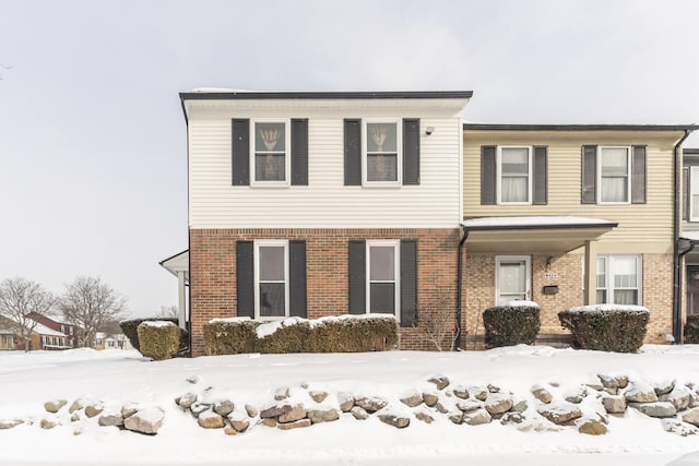 view of front of property featuring brick siding