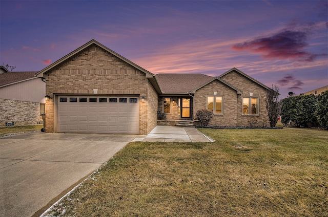 view of front of house with brick siding, a garage, concrete driveway, and a front yard