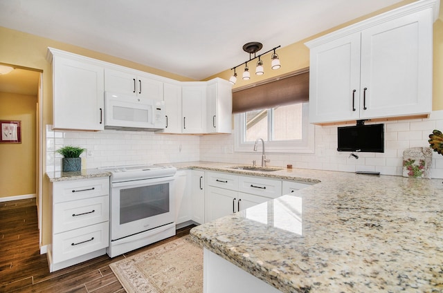 kitchen featuring dark wood-style floors, white appliances, a sink, and white cabinets