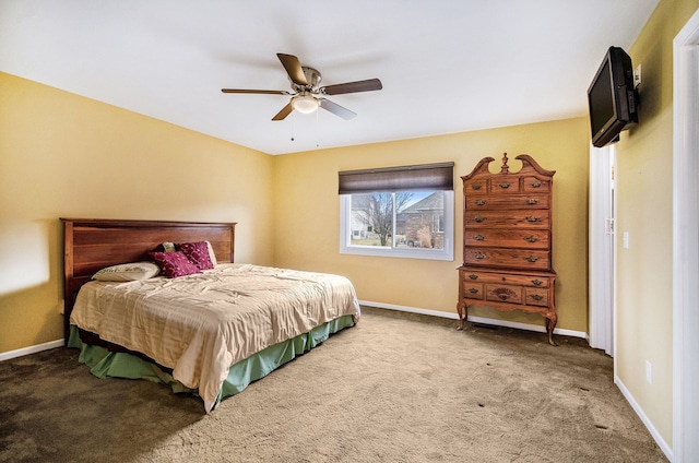 bedroom featuring carpet, a ceiling fan, and baseboards