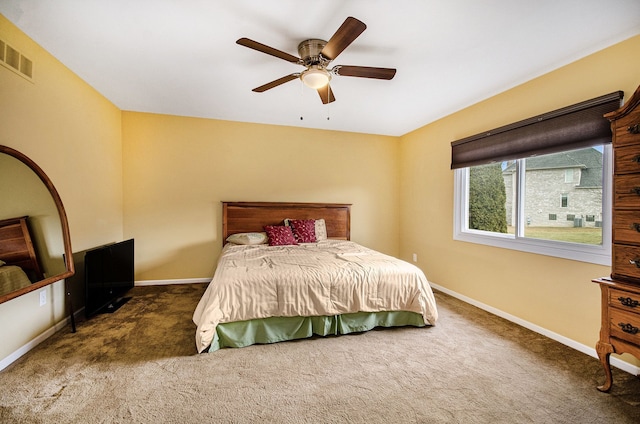 bedroom featuring a ceiling fan, carpet, visible vents, and baseboards