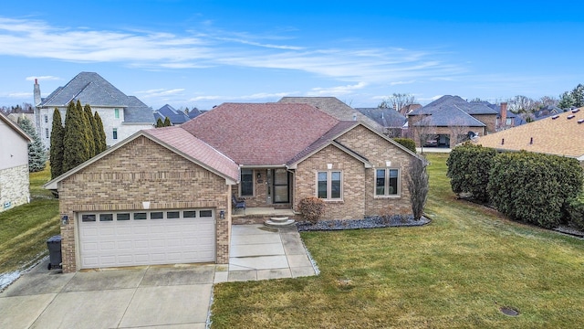 view of front of property featuring a garage, concrete driveway, roof with shingles, a front yard, and brick siding