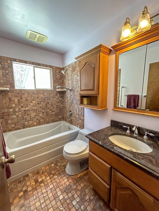 full bath with  shower combination, visible vents, vanity, and toilet