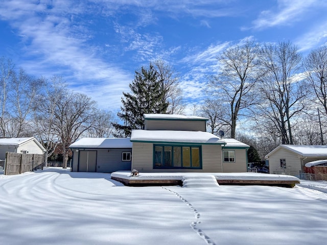 view of front of home featuring fence