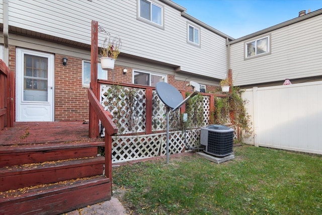 exterior space with fence and central AC unit