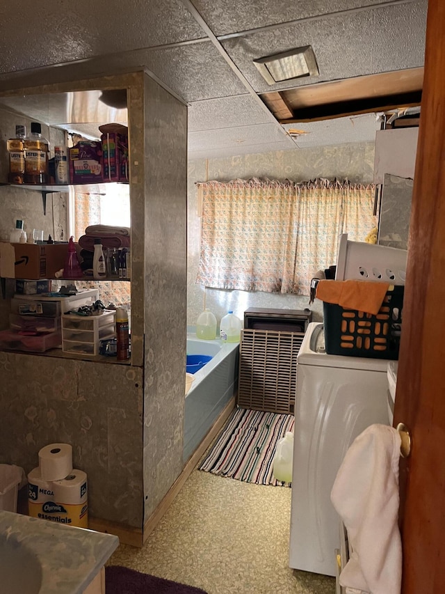 bathroom featuring washer / dryer