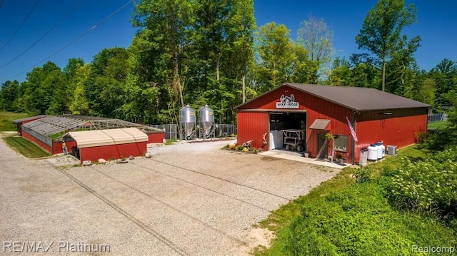 1286 Gray Fox Ct, Howell, MI 48843 - detached garage featuring driveway