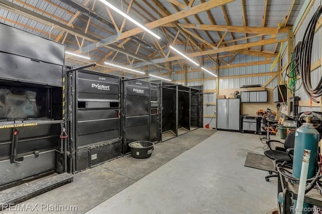 1286 Gray Fox Ct, Howell, MI 48843 - garage featuring freestanding refrigerator