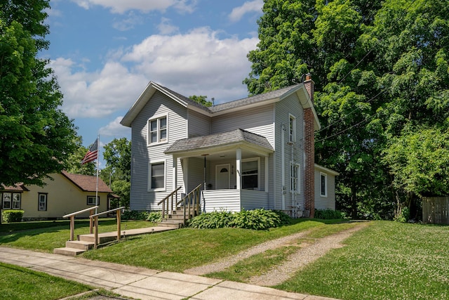 view of front of house featuring a front lawn and a chimney