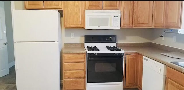 kitchen with white appliances and light countertops