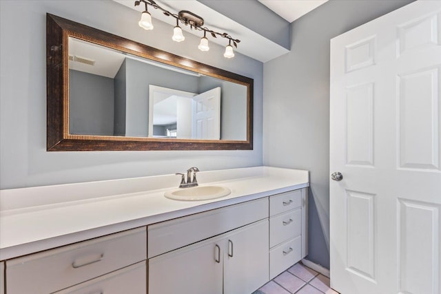 bathroom featuring tile patterned flooring, visible vents, and vanity