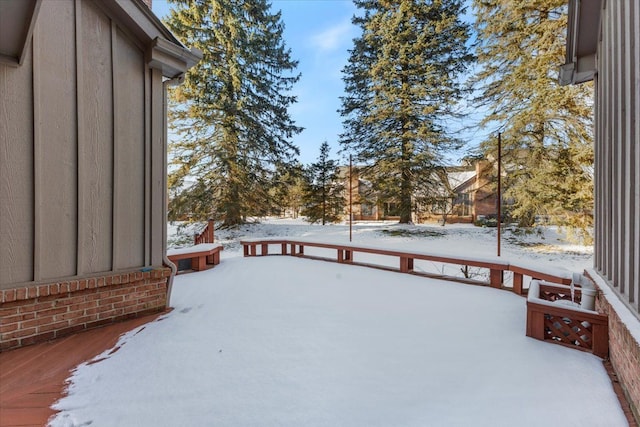 view of yard layered in snow