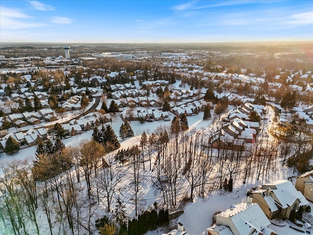 snowy aerial view featuring a residential view