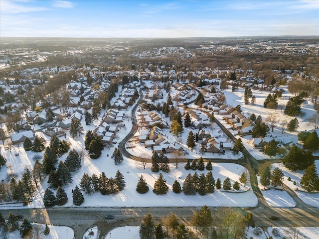 snowy aerial view featuring a residential view