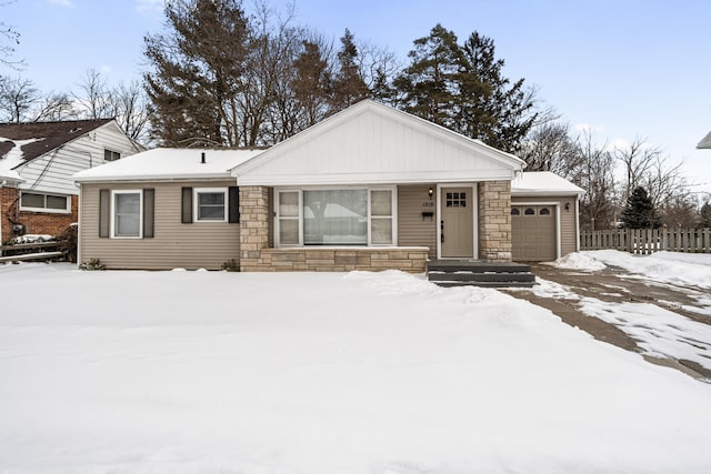 ranch-style home with stone siding and an attached garage