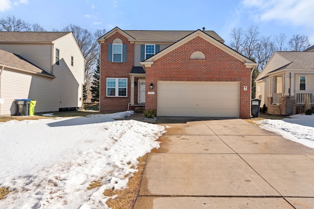 traditional-style house featuring concrete driveway and brick siding