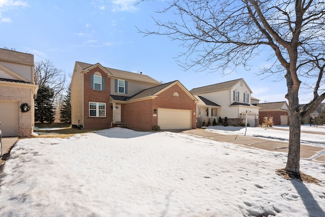 traditional-style home featuring brick siding and an attached garage