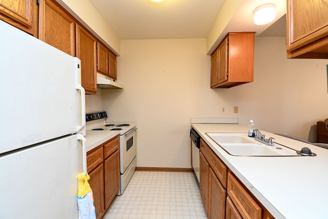 kitchen featuring light countertops, white appliances, brown cabinetry, and a sink