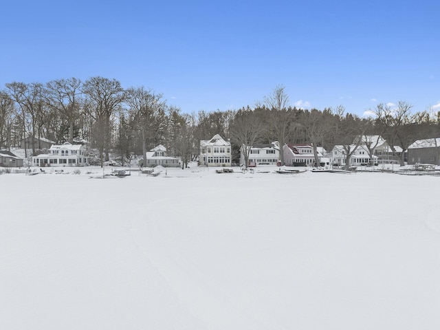 snowy yard with a residential view