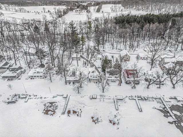 snowy aerial view featuring a residential view