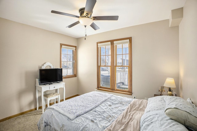 bedroom featuring carpet floors, baseboards, and a ceiling fan