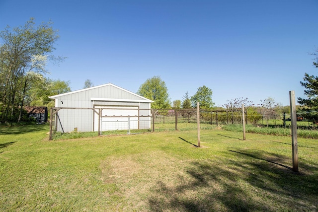 4898 Mount Morris Rd, Columbiaville, MI 48421 - view of yard featuring a pole building, an outbuilding, and a detached garage