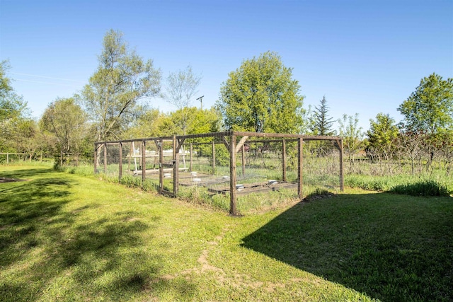 4898 Mount Morris Rd, Columbiaville, MI 48421 - view of green lawn featuring a vegetable garden