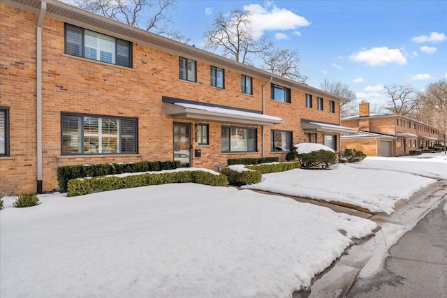 view of front of house with brick siding