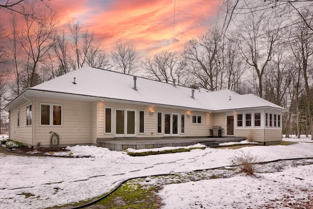 view of snow covered house