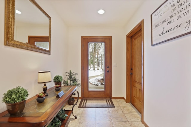 doorway to outside with baseboards and recessed lighting