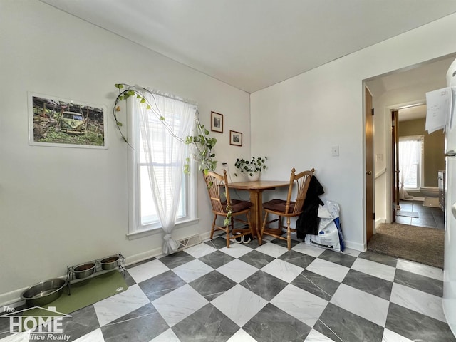 dining room with baseboards