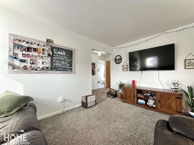 living room with baseboards and carpet flooring