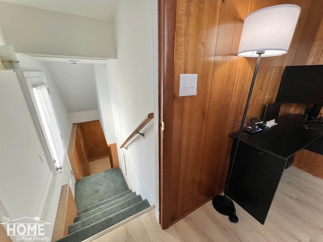 stairway with wood finished floors