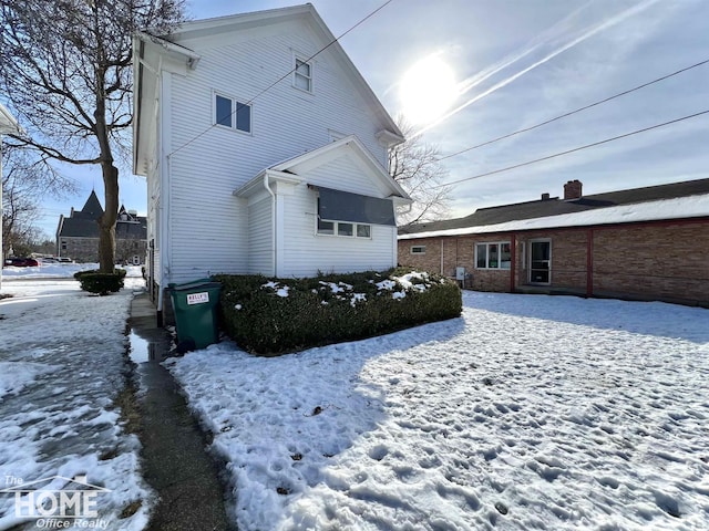 view of snow covered property