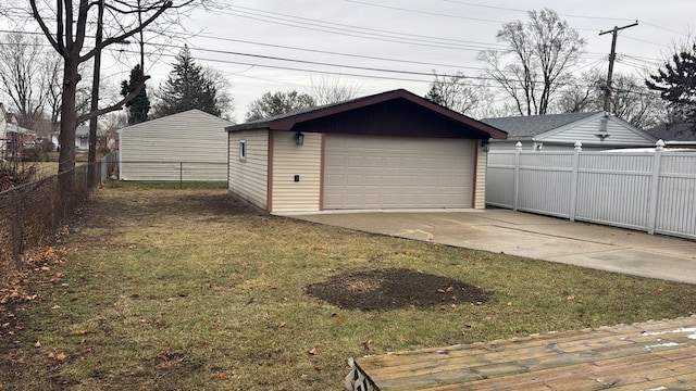 detached garage featuring fence